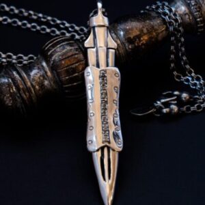 Silver sword pendant with intricate details.