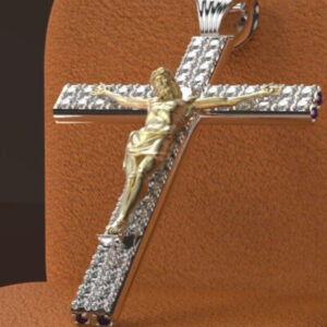 A cross with gold and silver crucifix on it.