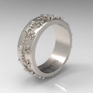 A silver ring with flowers on it