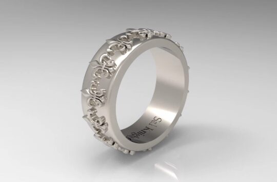 A silver ring with flowers on it