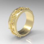 Gold ring with intricate floral design.