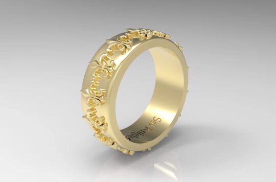 Gold ring with intricate floral design.