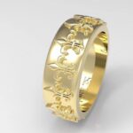 Gold ring with fleur-de-lis pattern.