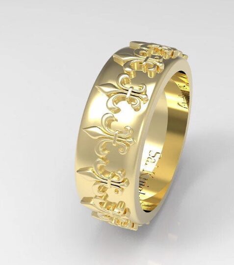 Gold ring with fleur-de-lis pattern.