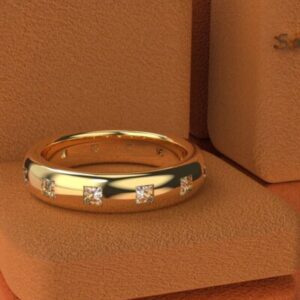 Gold ring with diamonds on display.